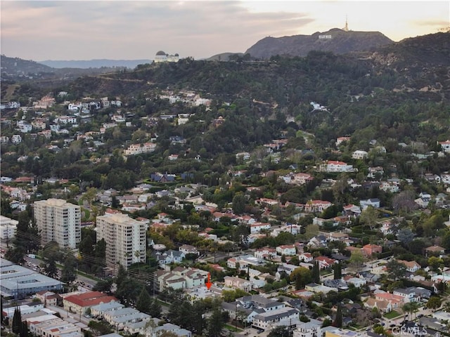 aerial view at dusk featuring a mountain view