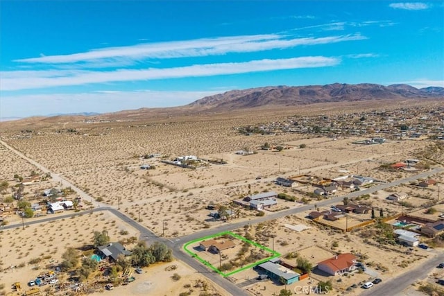 bird's eye view with a mountain view, a rural view, and view of desert