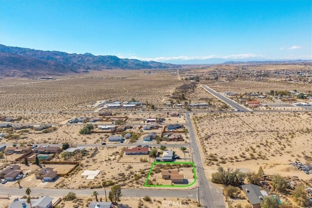 aerial view featuring view of desert, a rural view, and a mountain view