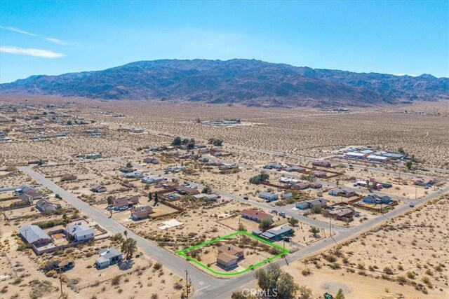 birds eye view of property with a mountain view, a rural view, and a desert view