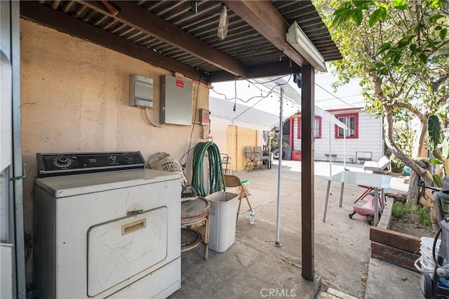 view of patio / terrace featuring electric panel and washer / clothes dryer