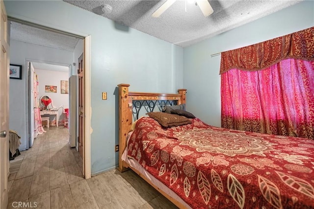 2359 Glover Pl, Los Angeles, CA 90031 - bedroom with wood finished floors, a ceiling fan, and a textured ceiling