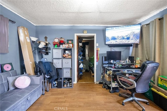 office area with a textured ceiling and wood finished floors