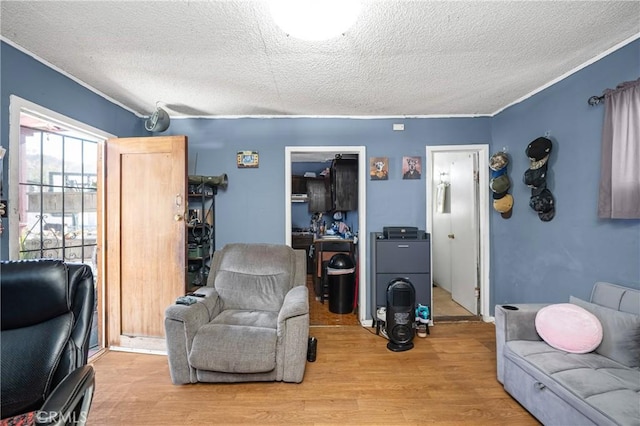 interior space featuring a textured ceiling and wood finished floors