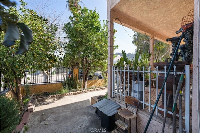 view of patio / terrace featuring fence