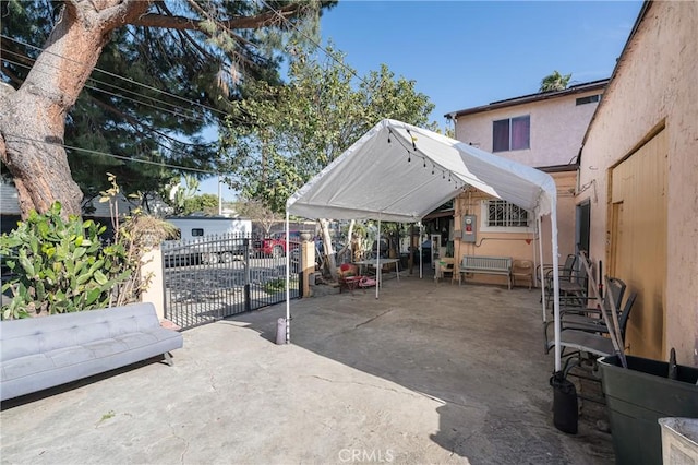 view of patio featuring fence