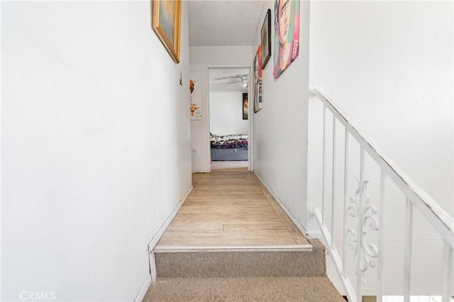 hallway featuring a textured ceiling