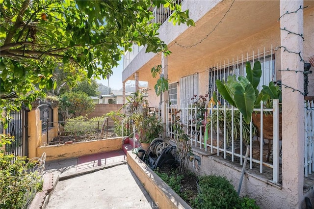 view of gate with a garden and fence