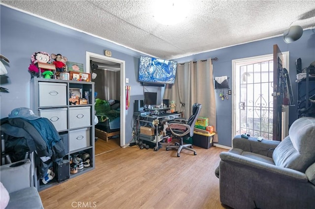 office area with wood finished floors and a textured ceiling