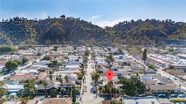 birds eye view of property with a residential view and a mountain view