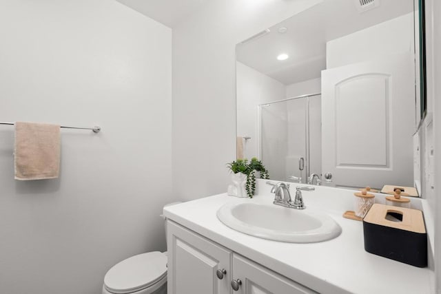 full bath with toilet, a shower stall, visible vents, and vanity