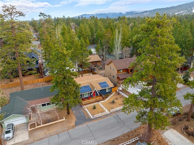 aerial view featuring a wooded view