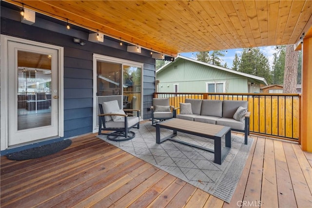 wooden deck featuring outdoor lounge area