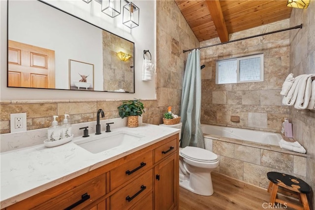 bathroom with toilet, wood ceiling, wood finished floors, tiled shower / bath combo, and tile walls