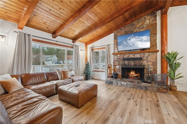 living area featuring wood ceiling, a fireplace, wood finished floors, and beam ceiling