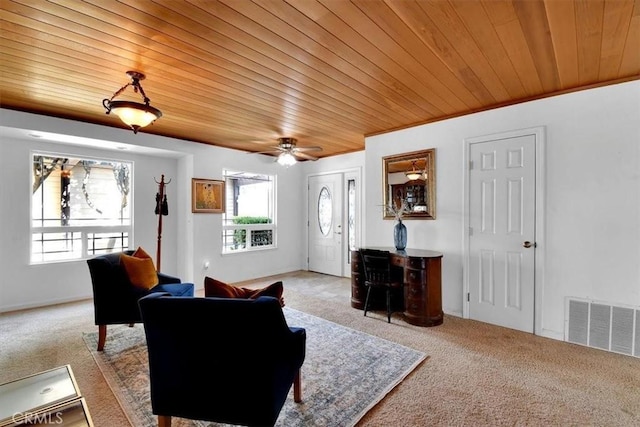 carpeted living room with a wealth of natural light, wood ceiling, visible vents, and crown molding