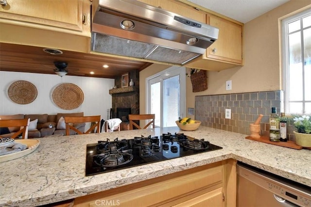 kitchen featuring black gas stovetop, extractor fan, a fireplace, backsplash, and dishwasher