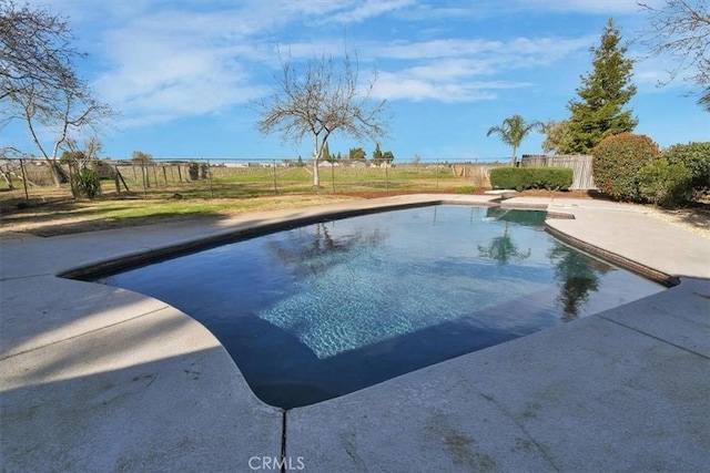 view of pool featuring a fenced in pool, a patio area, fence, and a diving board