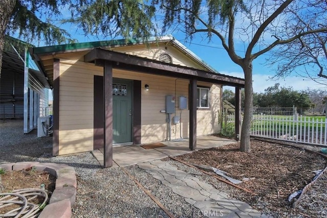 view of outbuilding with fence