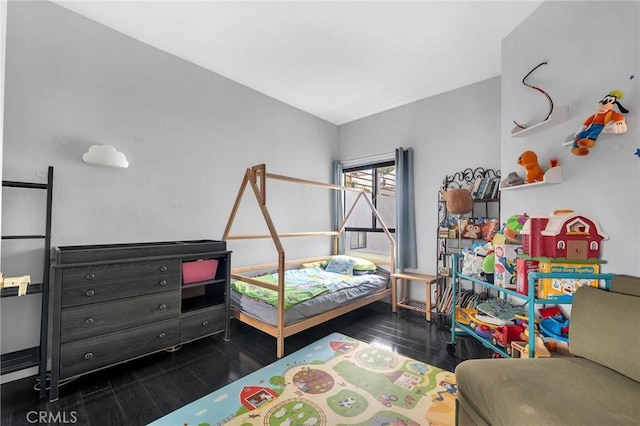 bedroom featuring wood finish floors