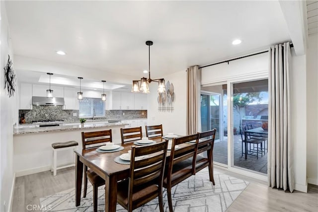 dining area featuring baseboards, recessed lighting, and light wood-style floors