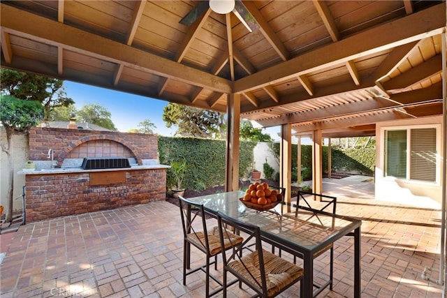 view of patio / terrace with a ceiling fan, outdoor dining space, fence, a pergola, and an outdoor brick fireplace