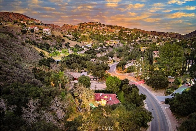 birds eye view of property with a mountain view