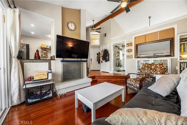 living room featuring a fireplace, visible vents, wood finished floors, high vaulted ceiling, and beamed ceiling