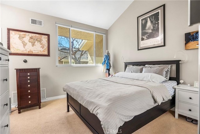 bedroom featuring light carpet, visible vents, and lofted ceiling