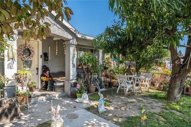 view of patio / terrace featuring fence