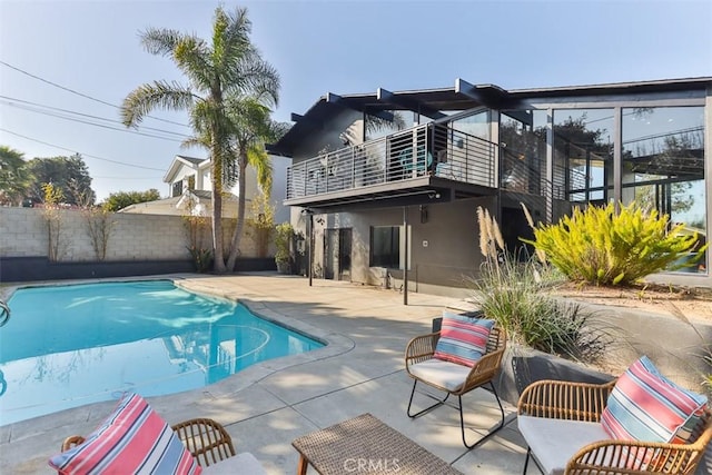 view of swimming pool featuring a patio area, a fenced backyard, and a fenced in pool