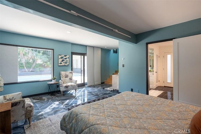 bedroom with marble finish floor and baseboards