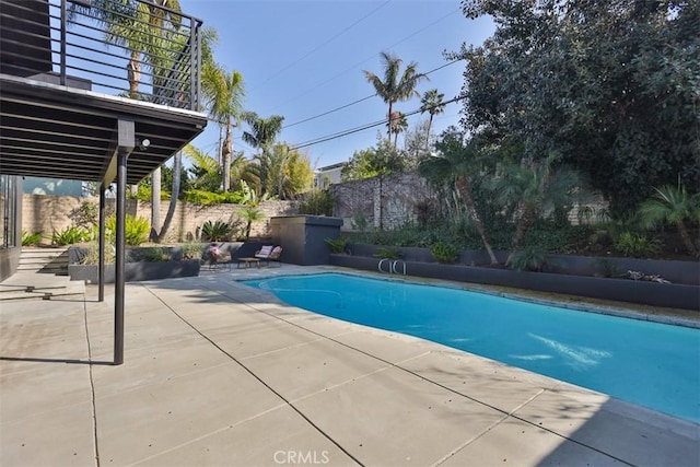 view of pool featuring a patio area, fence, and a fenced in pool