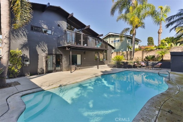 view of swimming pool featuring a fenced in pool, a patio, and fence