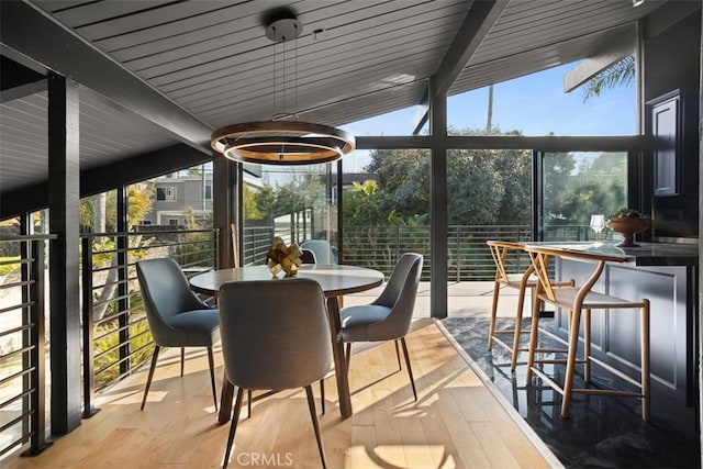 sunroom with beamed ceiling