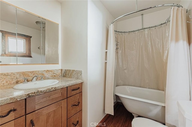 full bath featuring toilet, a shower with shower curtain, vanity, and a bath