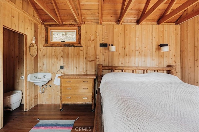 unfurnished bedroom featuring dark wood-style floors, wooden ceiling, beamed ceiling, and wooden walls