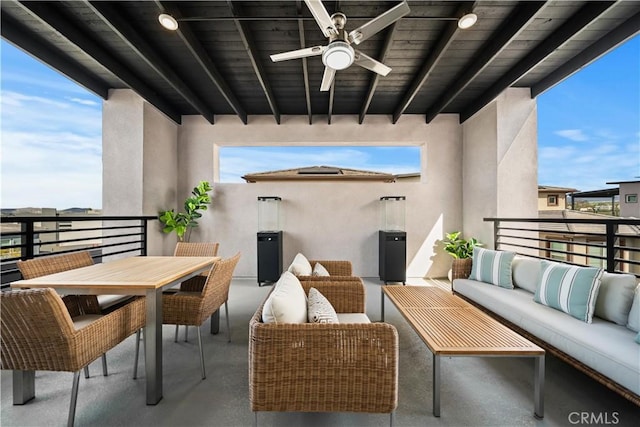 balcony with outdoor dining space, outdoor lounge area, and ceiling fan