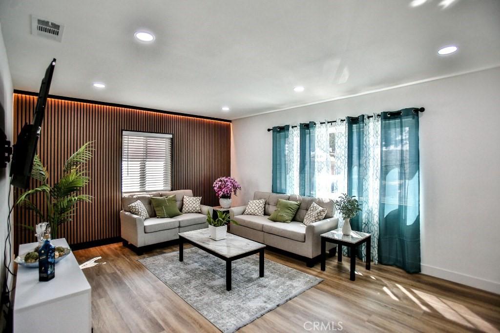 21514 Meyler St, Torrance, CA 90502 - living area with visible vents, baseboards, recessed lighting, and wood finished floors