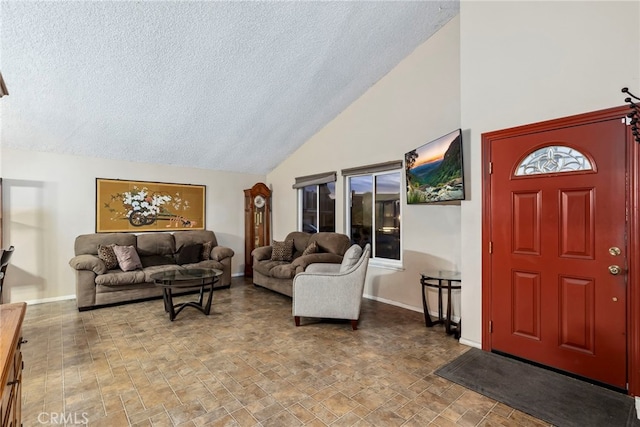 living room with vaulted ceiling, baseboards, and a textured ceiling