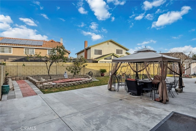 view of patio / terrace with a gazebo and a fenced backyard