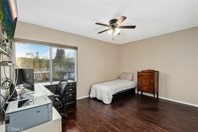 bedroom with access to exterior, baseboards, dark wood-style floors, a textured ceiling, and a ceiling fan