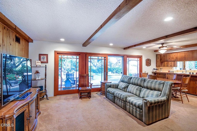 living room featuring light carpet, visible vents, a textured ceiling, beam ceiling, and recessed lighting