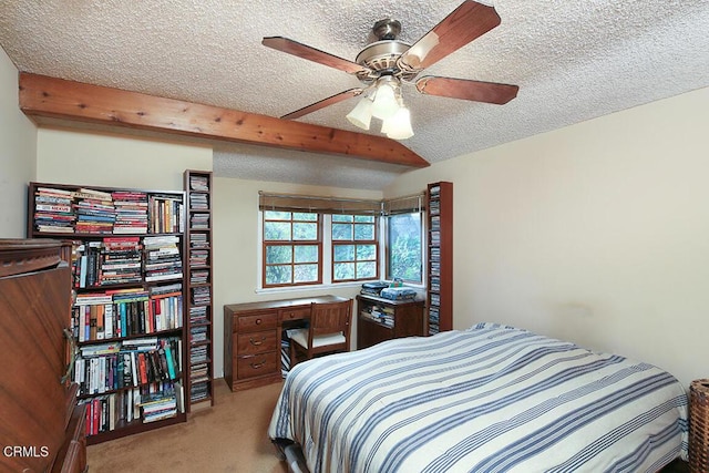 bedroom with a textured ceiling, carpet floors, and beamed ceiling