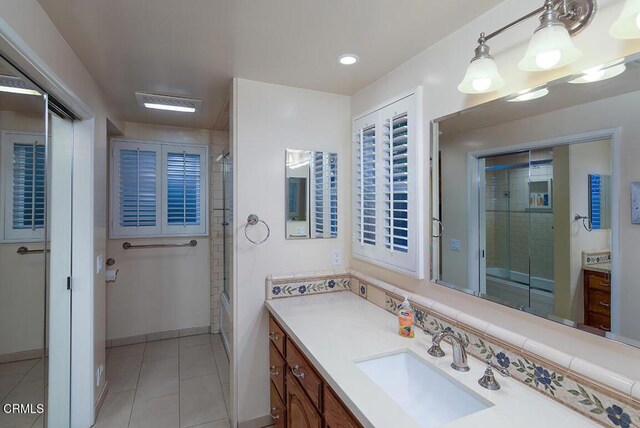 full bath featuring tile patterned floors, recessed lighting, baseboards, and vanity