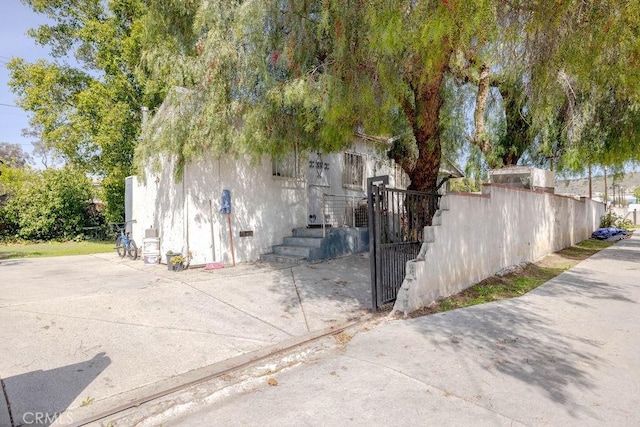 exterior space featuring crawl space and fence