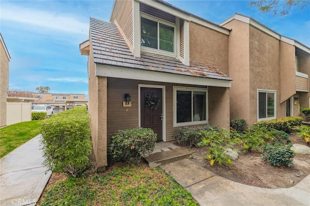 townhome / multi-family property featuring stucco siding