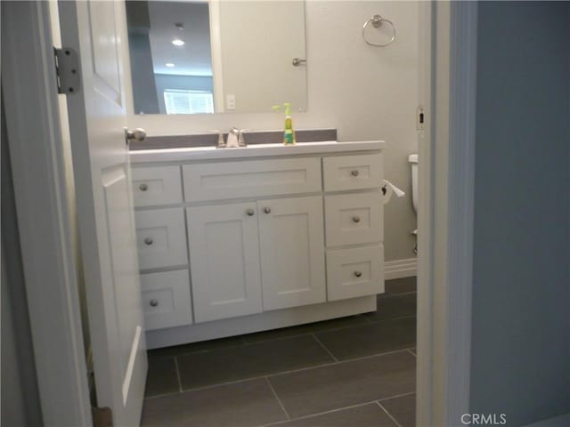 bathroom with tile patterned flooring and vanity