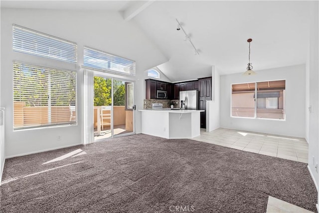 unfurnished living room with light carpet, light tile patterned floors, beamed ceiling, high vaulted ceiling, and track lighting