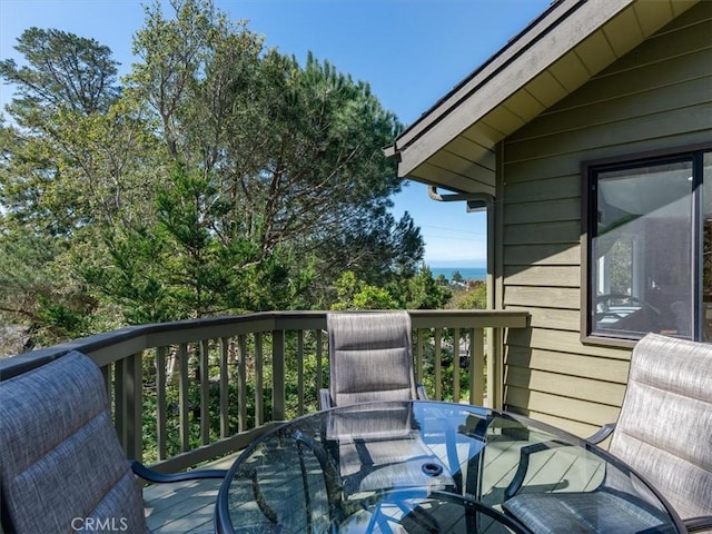 wooden deck featuring outdoor dining space